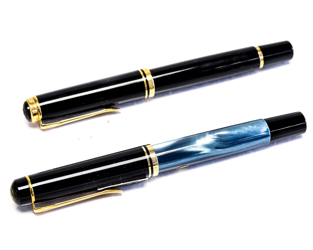 A Pelikan M200 fountain pen, black resin with gold trim, 18 carat gold broad nib,