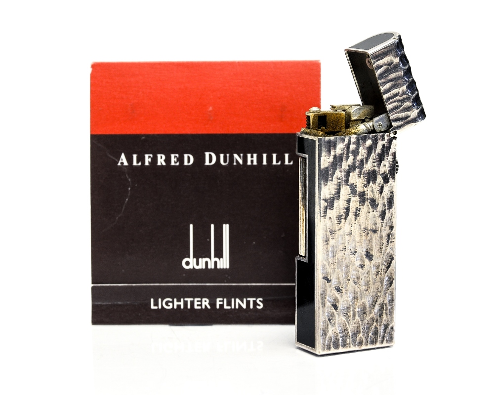 Alfred Dunhill, a silver plate and black enamelled lighter, bark effect with domed lid,