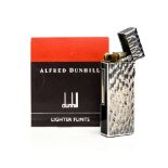 Alfred Dunhill, a silver plate and black enamelled lighter, bark effect with domed lid,