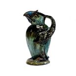 C H Brannam, Barum, an Art Pottery grotesque bird jug, 1907, majolica glazed in green and brown,