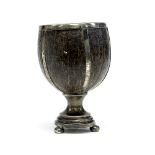 An Arts and Crafts silver mounted coconut cup, the bowl interior gilded, with strapwork decoration,