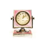 An Art Deco silver and enamelled bedside timepiece, pink guilloche enamel,