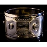A Victorian silver bangle, filigree banding and screw tongues, in the Industrial,