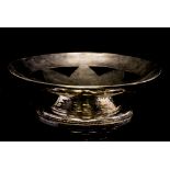 An Arts and Crafts silver plated pedestal bowl, hand hammered silver on copper,