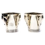 A pair of Arts and Crafts silver cups, of square conical form,