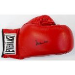 Boxing Memorabilia: A signed Muhammad Ali Everlast boxing glove.