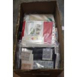 One box of assorted stamps to include First Day Covers,