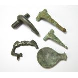 Group Of Five Roman Bronze Artefacts An incomplete Roman military dolphin style buckle,