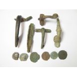 Roman Brooch and Coin Group Four Roman brooches 1st-2nd Century AD Together with a late Iron Age
