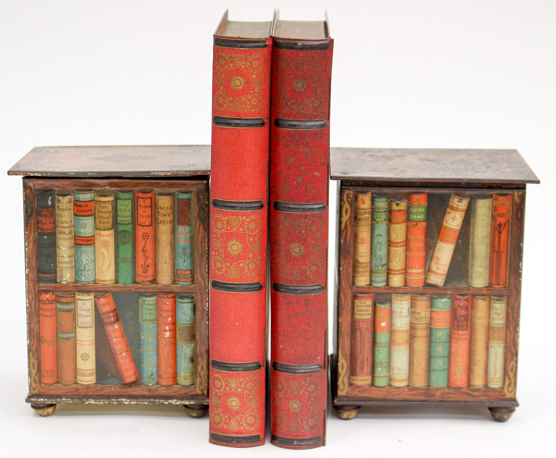 A pair of Huntley and Palmer biscuit tins, in the shape of red books,