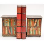 A pair of Huntley and Palmer biscuit tins, in the shape of red books,