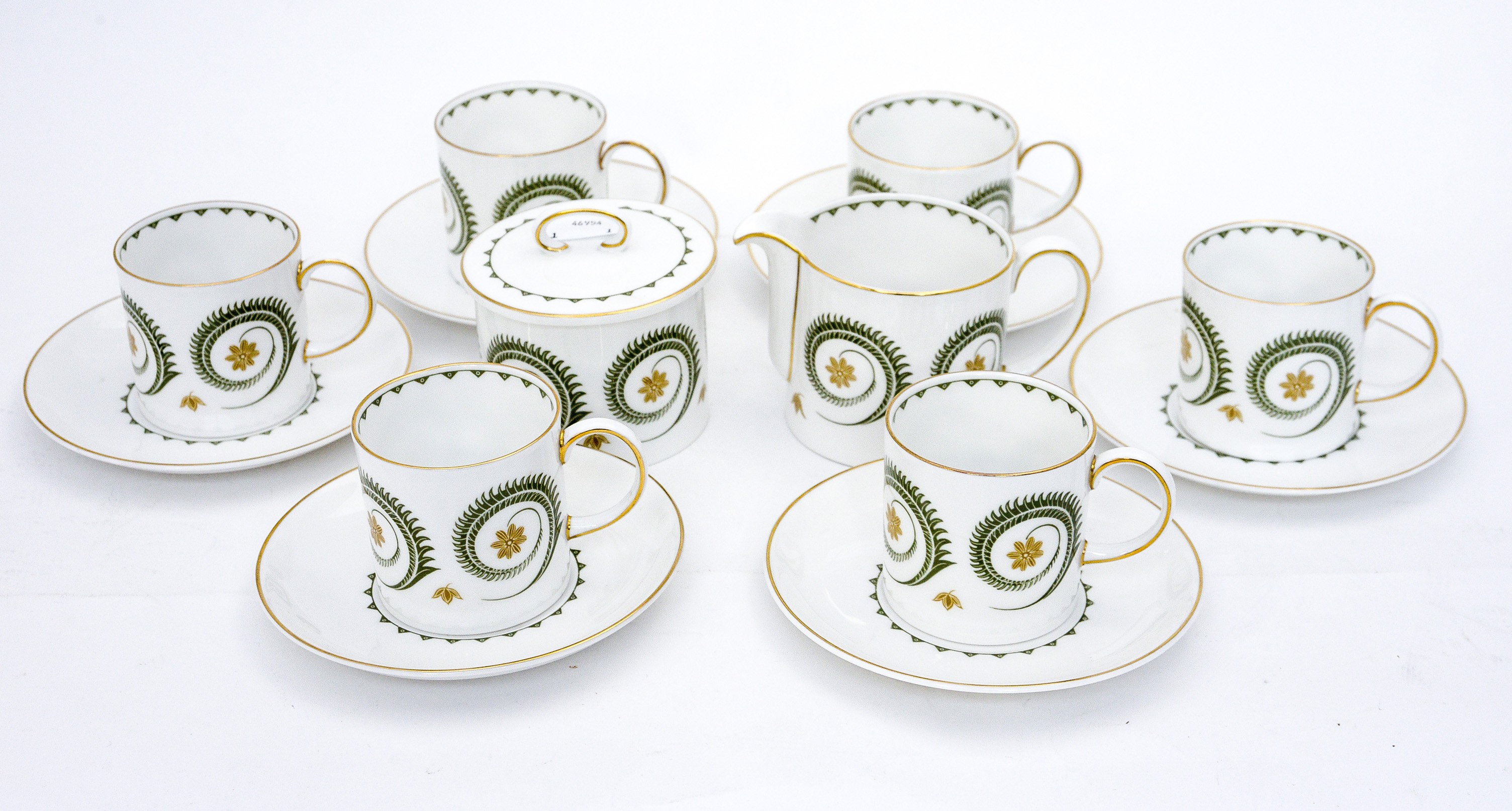 A Susie Cooper bone china 'Assyrian Motif' pattern coffee service, comprising six cups, six saucers,