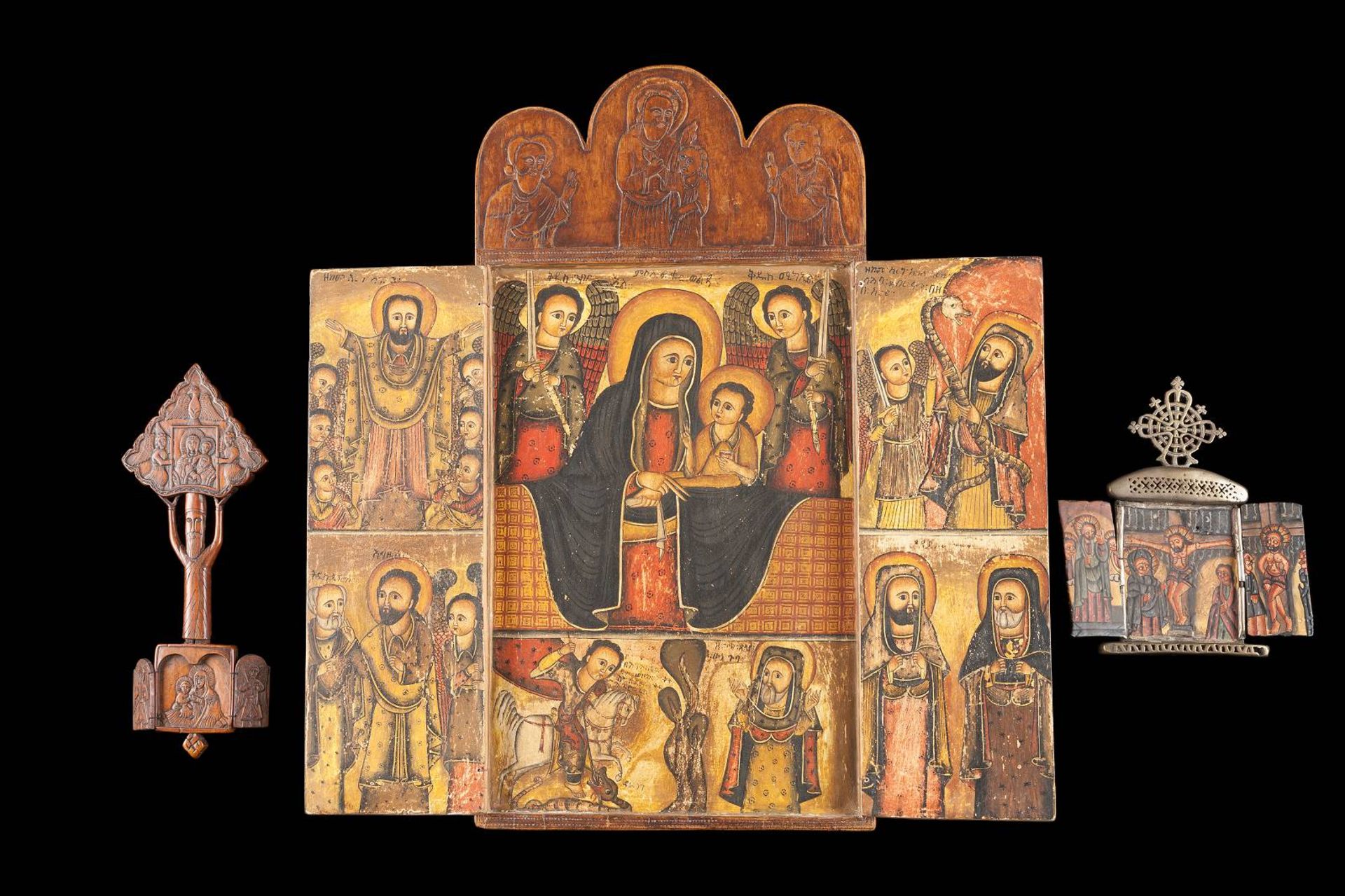 THREE COPTIC TRIPTYCHSEthiopian, 19th century Tempera on wood panels, carved. Comprising a large