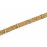 BRILLANT-ARMBAND Gelbgold, Weißgold. L. 18,5 g, Ges.-Gew. ca. 39,9 g. Gest. 750, Herstellersignet.