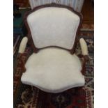 A French style beach and upholstered chair, with a shield shaped back and open arms, on cabriole