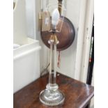 A Victorian style glass table lamp, with octagonal tapered column on a star cut circular base. H.