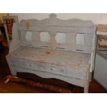 A continental style pine settle with distressed pale blue paint,