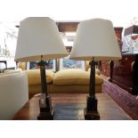 A pair of 18th century style gilt metal and marble Ionic column table lamps and shades. H.