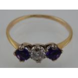 An amethyst and diamond set three stone ring, on a yellow metal band stamped 9ct, 1.7g.