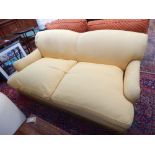 A large 20th century yellow fabric upholstered sofa,