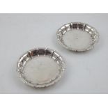 A pair of Victorian silver pin dishes of shaped circular form Richard Comyns London 1873.