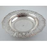 An early 20th century Egyptian silver bonbon dish of engraved circular form with pierced border on