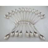 A set of twelve French silver oyster spoons with shell and thread decoration together with eight