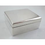 An early 20th century Chinese silver cigarette box of plain rectangular form, cedar lined,