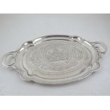 A 19th century Russian 84 zlotnik engraved silver two handled card tray of shaped oval form,