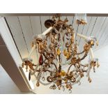 An 18th century style gilt metal five branch electrolier, the acanthus scroll arms hung multi-