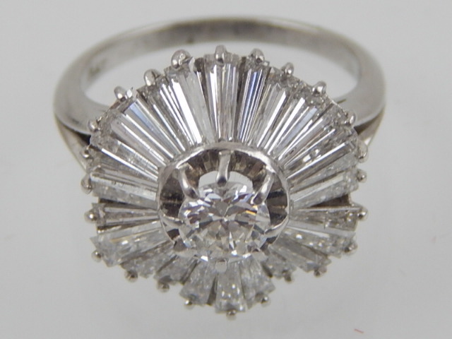 A diamond cluster ring with central brilliant cut stone surrounded by twenty four tapered - Image 3 of 6