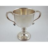 A modern silver twin handled trophy cup, on knopped stem, Sheffield 1985, by J. Dixon & Sons, weighs