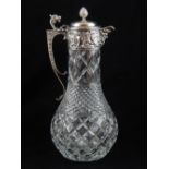 A modern Victorian style silver mounted cut glass claret jug, with mask spout and cast dragon