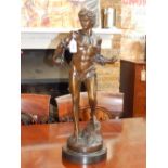 After Barie, a patinated bronze of David, on circular reconstituted marble base. H. 64cm