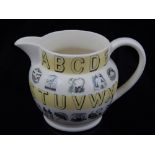 Eric Ravilious for Wedgwood, an alphabet series cream jug with pale yellow glazed bands. H. 10cm