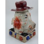 A 19th century Staffordshire figure of a two headed dog wearing a hat. H. 23cm