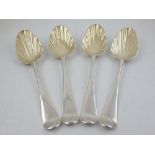 A set of four George II silver table spoons, with later shell embossed gilded bowls, London 1753, by