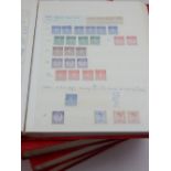 Four red stock books containing comprehensive GB stamp collection 1960's-1980's, mint and used,