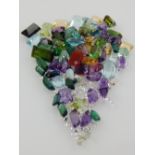 A good collection of unmounted gemstones, including diamonds, tourmalines, aquamarines and