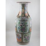A large 19th century Chinese Canton baluster shape vase, having gilded twin dog of Fo handles,