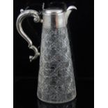 An Edwardian silver mounted cut glass claret jug with scroll handle, Birmingham 1905, by Walker &