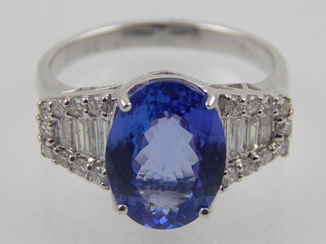 An 18 carat white gold, diamond, and tanzanite ring, set oval cut tanzanite of 3.0 carats, the - Image 2 of 4