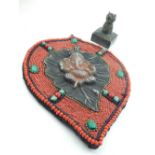 An Hindu beadwork wall plaque, applied with central silvered metal Ganesh, H. 30cm, together with