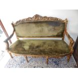 A Louis XVI design giltwood settee with pierced scroll chest rail and acanthus arms on six turned