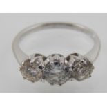 An 18 carat white gold and diamond ring, set three round cut stones of approx. 1.40 carats combined.