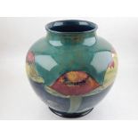 A large Moorcroft Claremont pattern baluster vase, the tube lined body on a mottled green blue