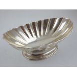 A late Victorian silver dish of fluted elliptical form, London 1897, by Heath and Hartshorne of