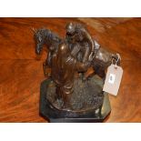 A Victorian style dark patinated bronze of an Arabian lady on horseback with male attendant. H.