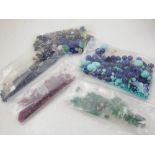 A large quantity of assorted unmounted gemstones, including rubies, emeralds, sapphires,