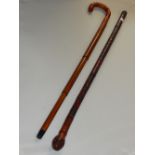 An early 20th century Chinese carved bamboo walking cane together with a later walking stick with